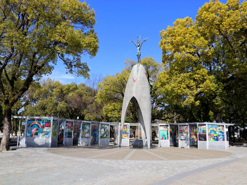 Bronze statue of 'Children's Peace Monument' which is surrounded by rooms that contain millions of paper cranes sent from all over the world praying for peace. It is located within Hiroshima Peace Memorial Park in Japan.